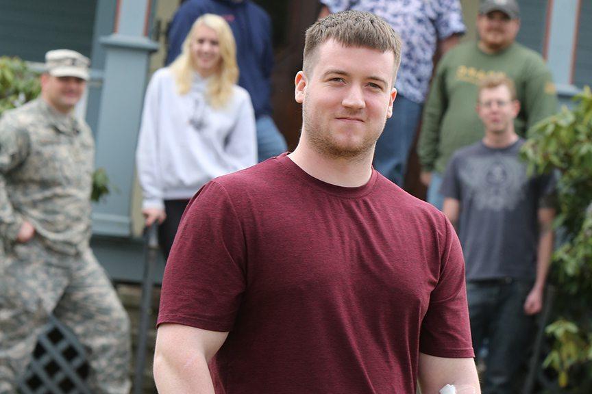 keystone college veteran students stand in front of Veteran Center